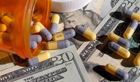 Eli Lilly falls on profit downgrade; drug sales surge