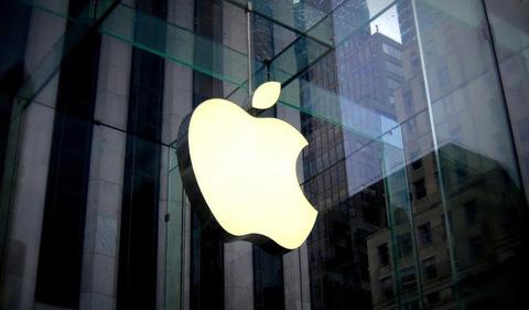 Apple earnings fall on tax charge; Q4 revenue a record