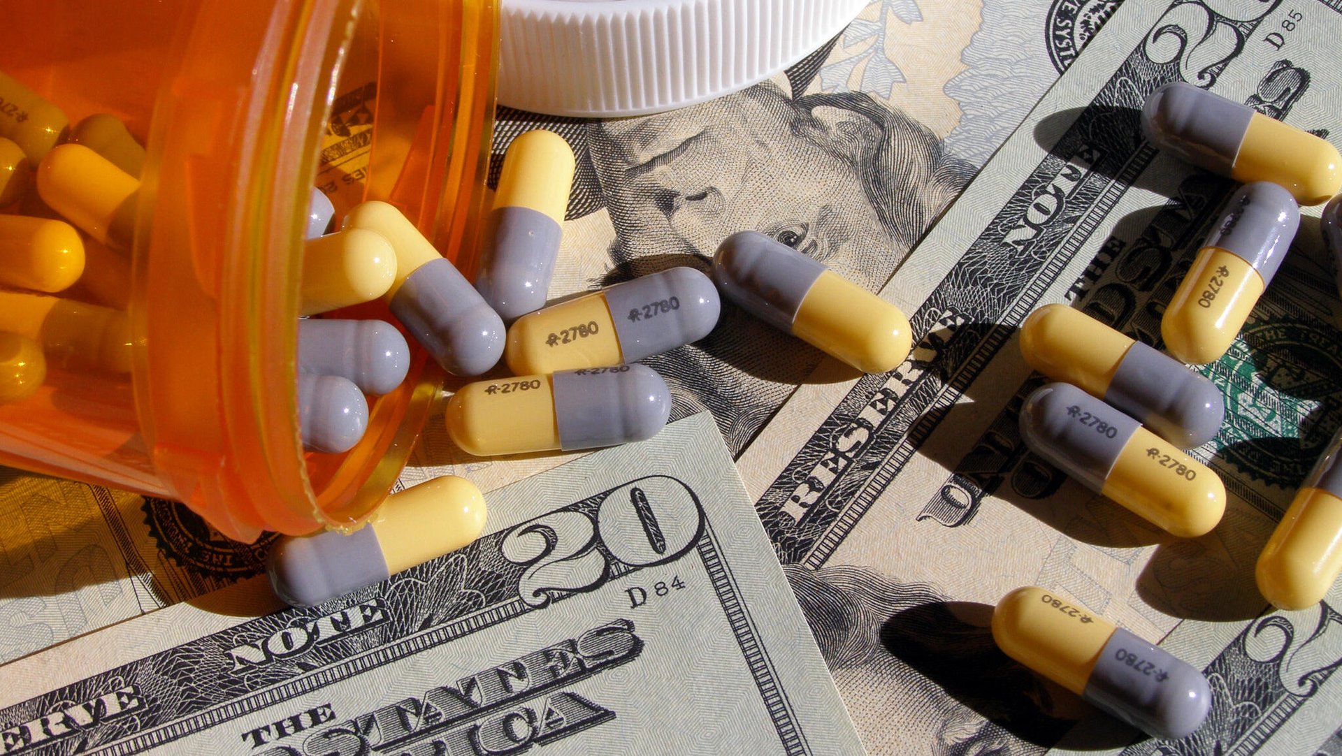 Eli Lilly falls on profit downgrade; drug sales surge