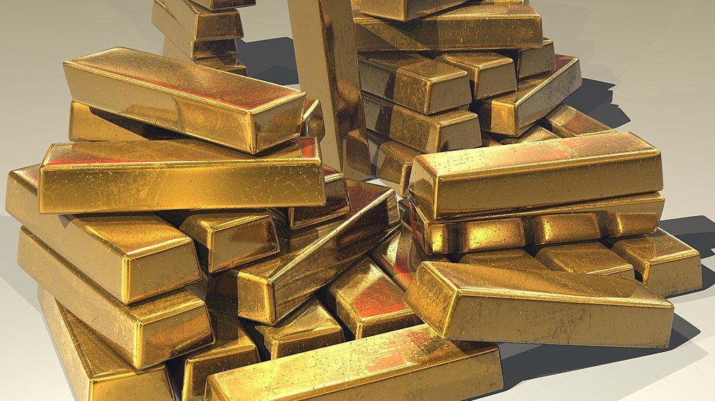 Gold prices hold near record highs ahead of US inflation data